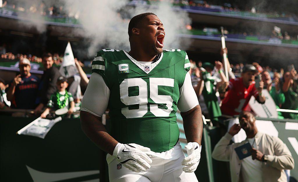The New York Jets' Quinnen Williams runs on to the pitch before the NFL game against the Denver Broncos at Tottenham Hotspur Stadium in London