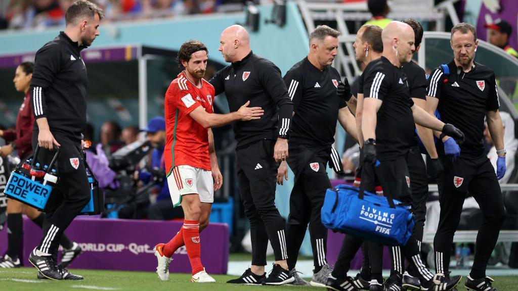 Joe Allen comes off against England during the 2022 World Cup