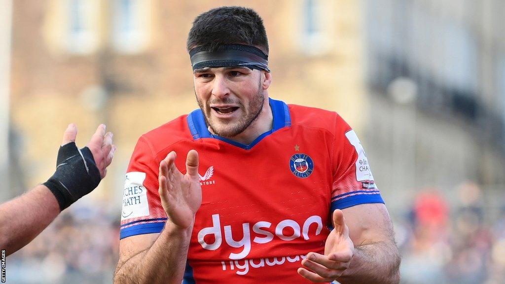 Josh Bayliss claps his hands on the pitch during a Champions Cup match for Bath