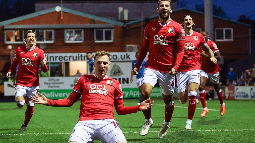 George Maris celebrates scoring for Mansfield at Stockport