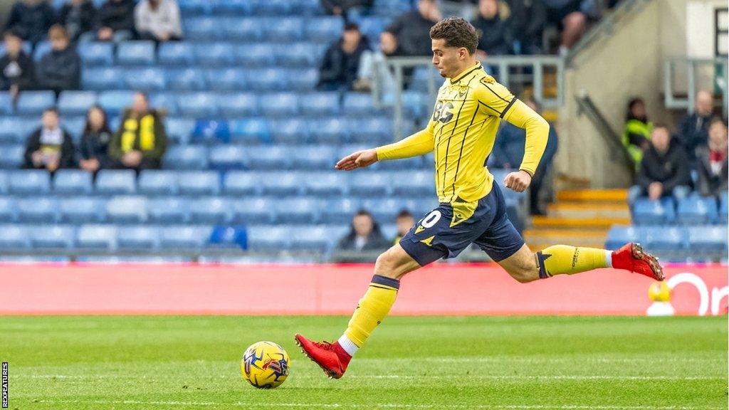 Ruben Rodrigues preparing to strike the ball for Oxford United