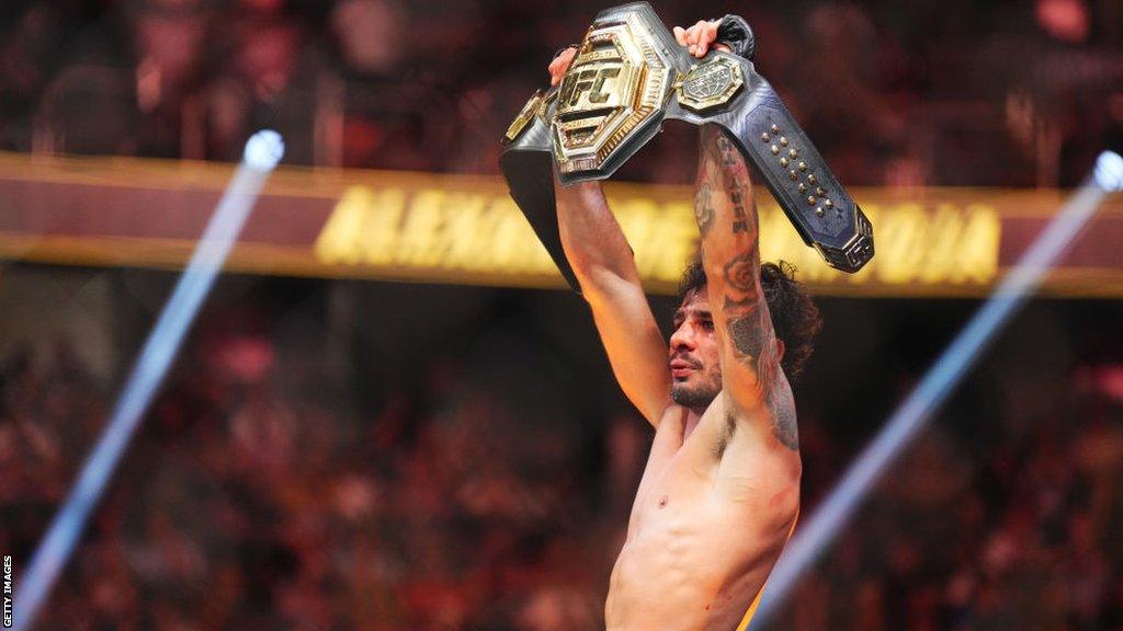 Alexandre Pantoja celebrates winning the UFC flyweight title