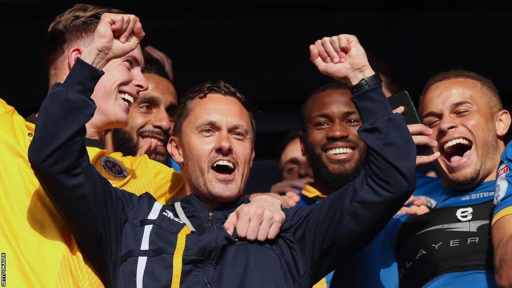 Paul Hurst celebrating with his Shrewsbury players during his first spell at the club