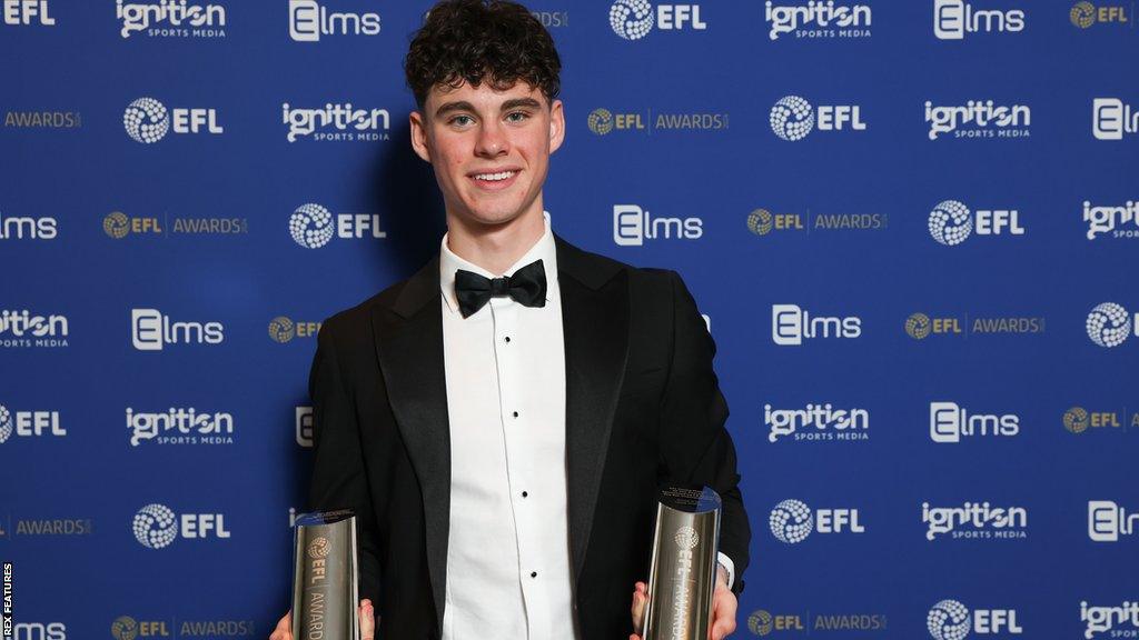 Archie Gray holds his young player and apprentice of the season awards