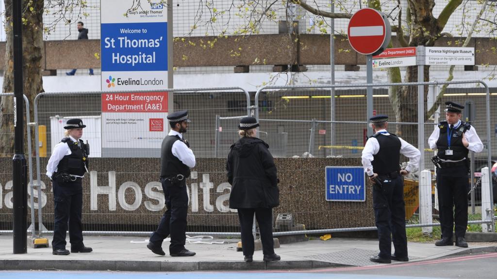 Police stand guard outside St.Thomas"s Hospital in London, Britain, where Johnson is in intensive care