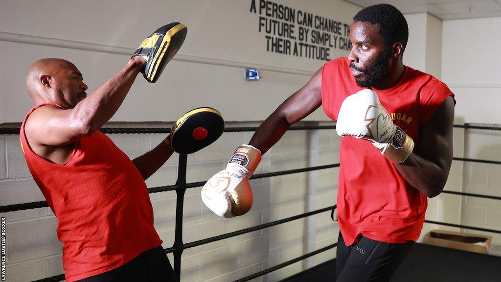 Sugar Hill Steward and Lawrence Okolie on pads