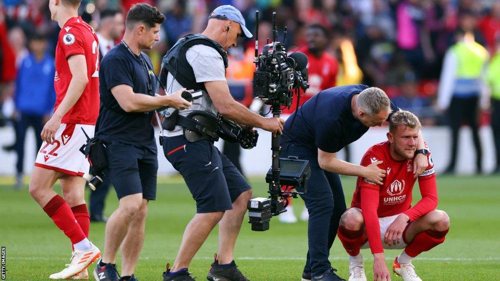 Nottingham Forest defender Joe Worrall is embraced by manager Steve Cooper after the win over Arsenal