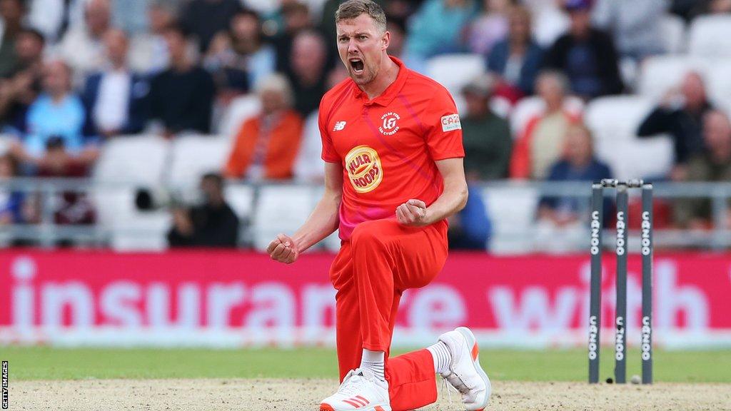 Welsh Fire bowler Jake Ball celebrates taking a wicket