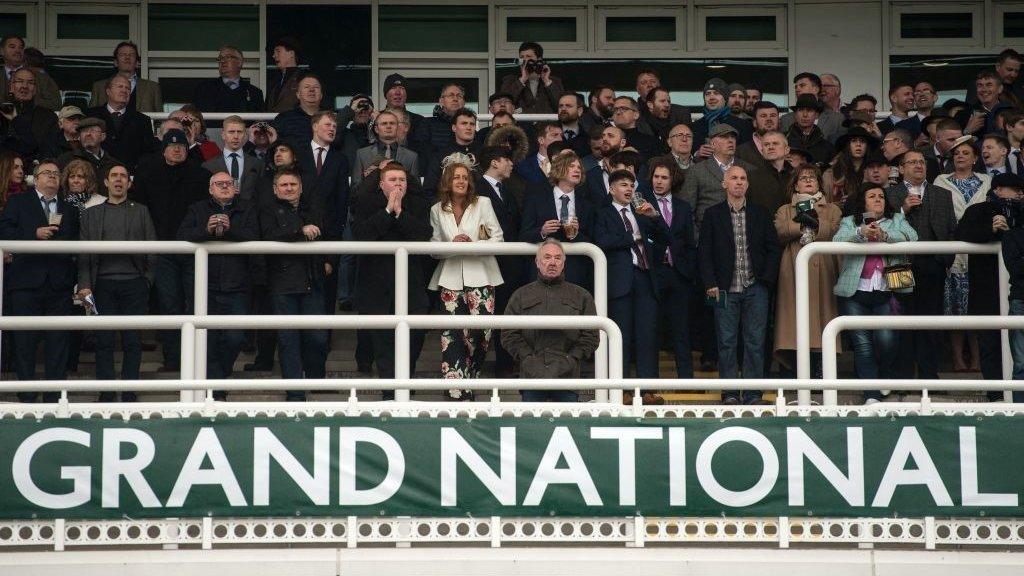 Spectators at Aintree's Grand National meeting