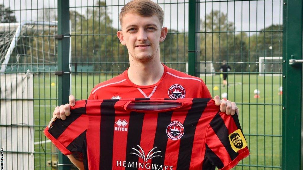 James Taylor poses with a Truro City shirt