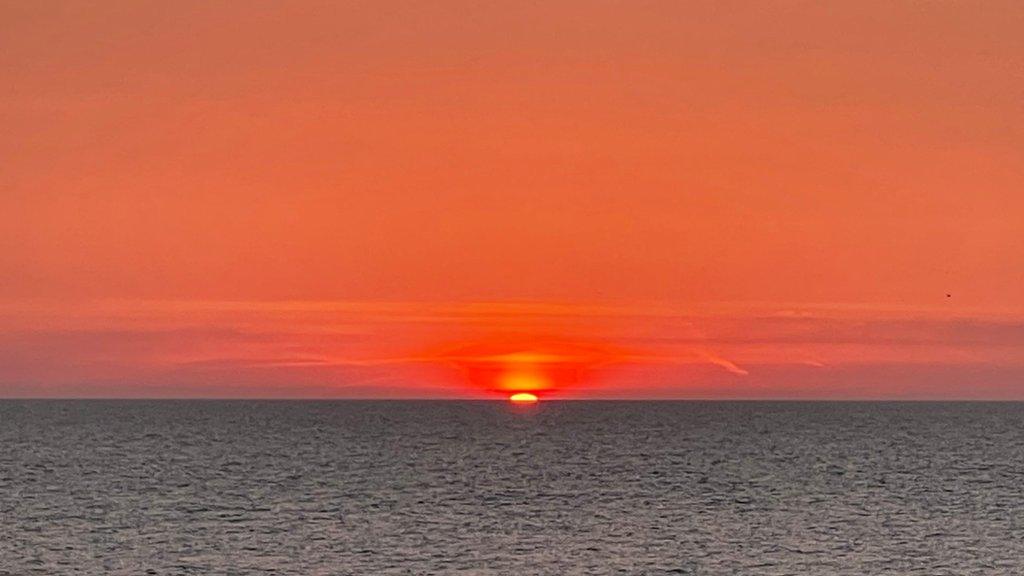 Red skies at sunrise in Aldeburgh, Suffolk.