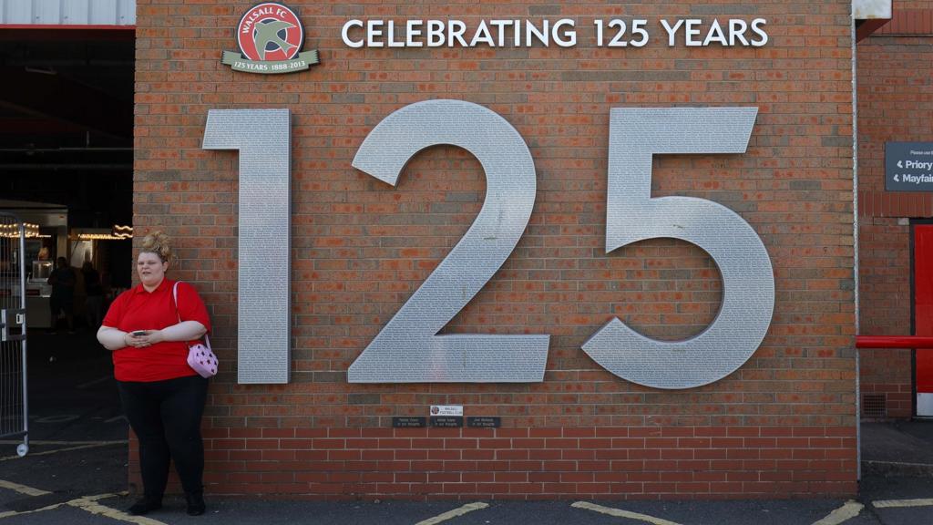 A sign outside Walsall's ground celebrates their 125-year anniversary