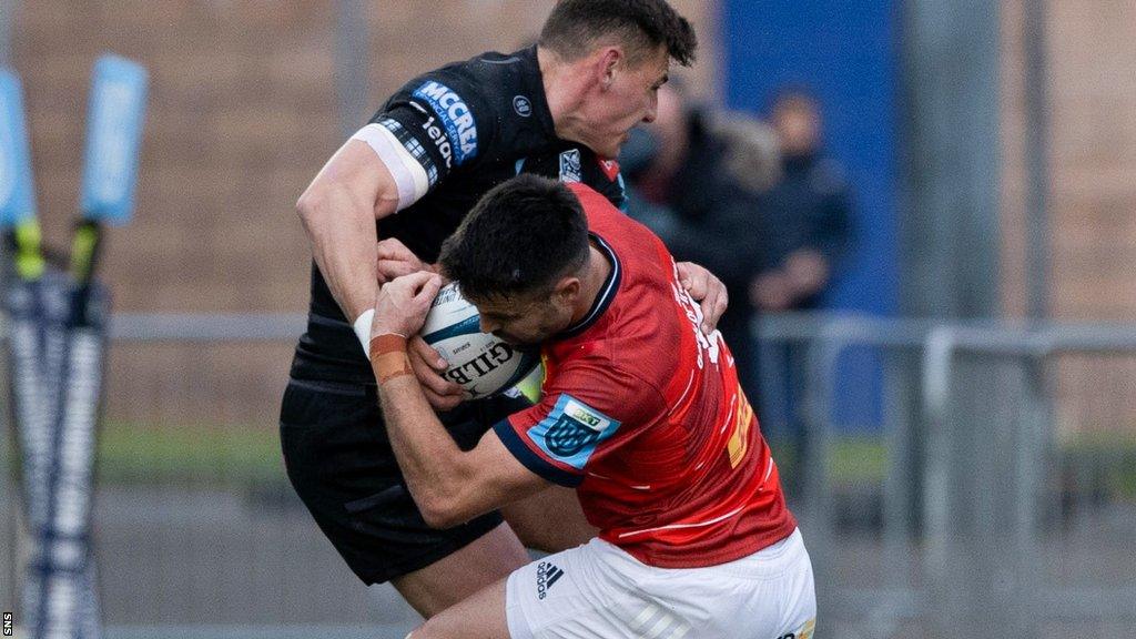 Glasgow Warriors' Tom Jordan tackles Munster's Connor Murray