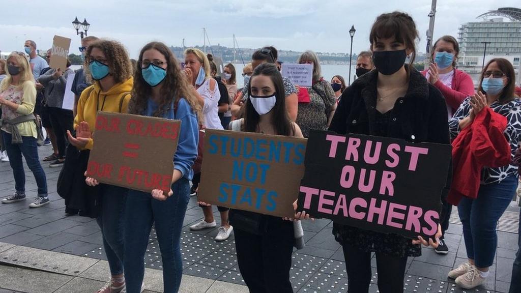 Students holding placards