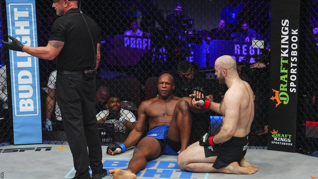 Linton Vassell sits down exhausted after the referee stops the fight