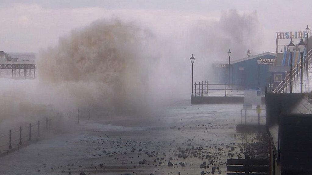 Waves crashing on sea wall at Cromer