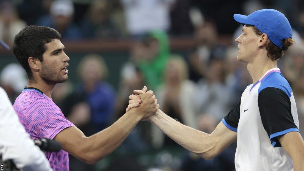 Carlos Alcaraz and Jannik Sinner meet at the net after their match at Indian Wells