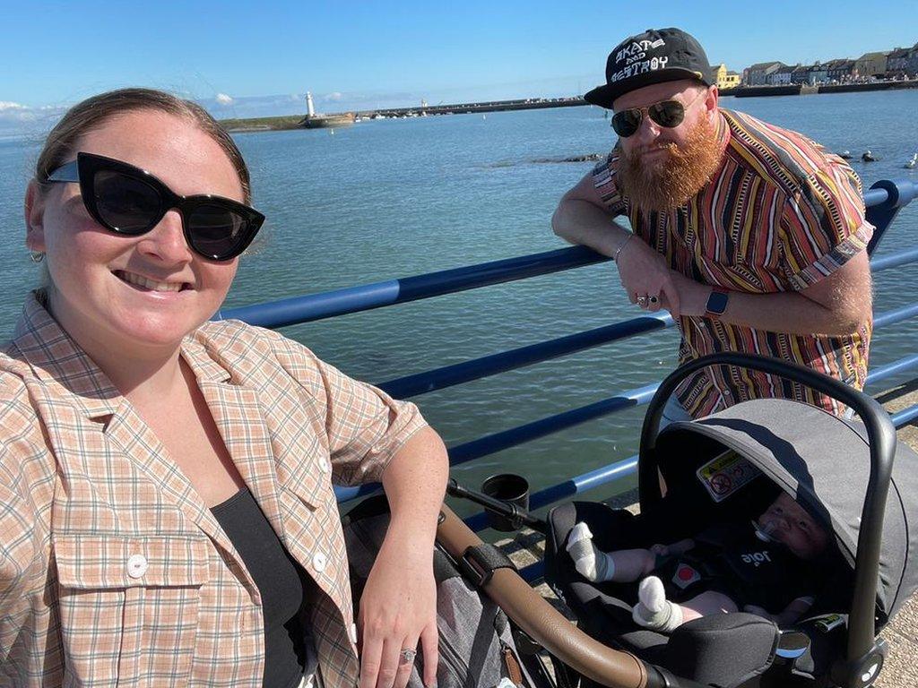 Aimee, Sean and baby Vinnie by the sea in Donaghadee