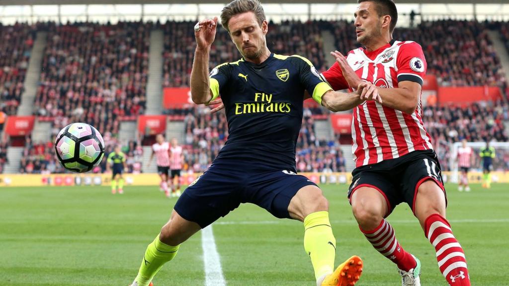 Nacho Monreal of Arsenal and Dusan Tadic of Southampton