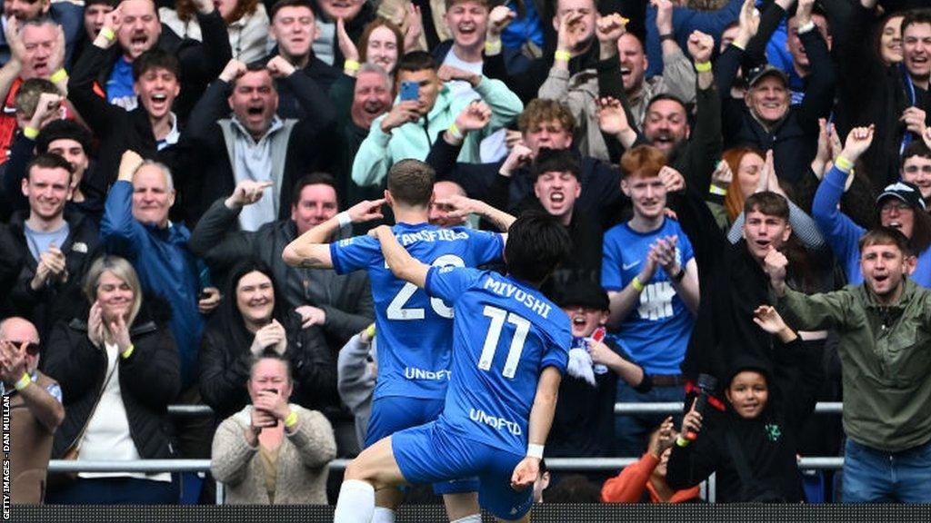 Jay Stansfield celebrates with Koji Miyoshi at St Andrew's