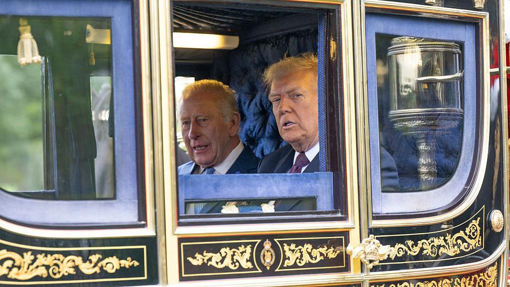 Donald Trump and Prince Charles in a carriage