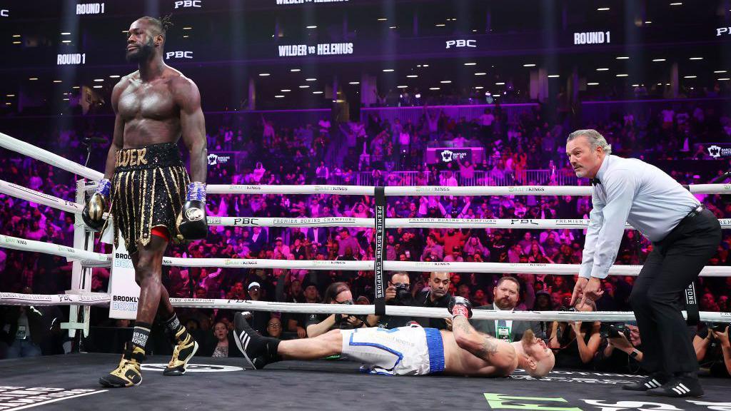 Deontay Wilder walks way from an unconscious Robert Helenius