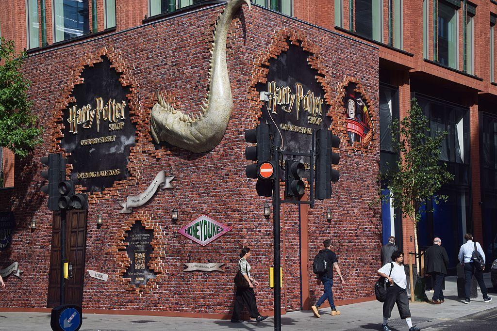 People walk past the new Harry Potter store on Oxford Street.