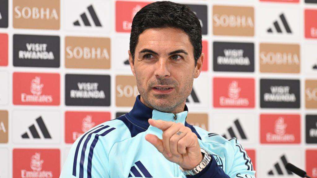 Mikel Arteta gestures towards a reporter