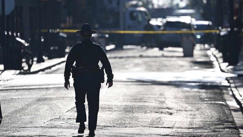 A police officer patrols the French Quarter, after an attack by a man driving a truck down Bourbon street the day before, early on January 2, 2025 in New Orleans