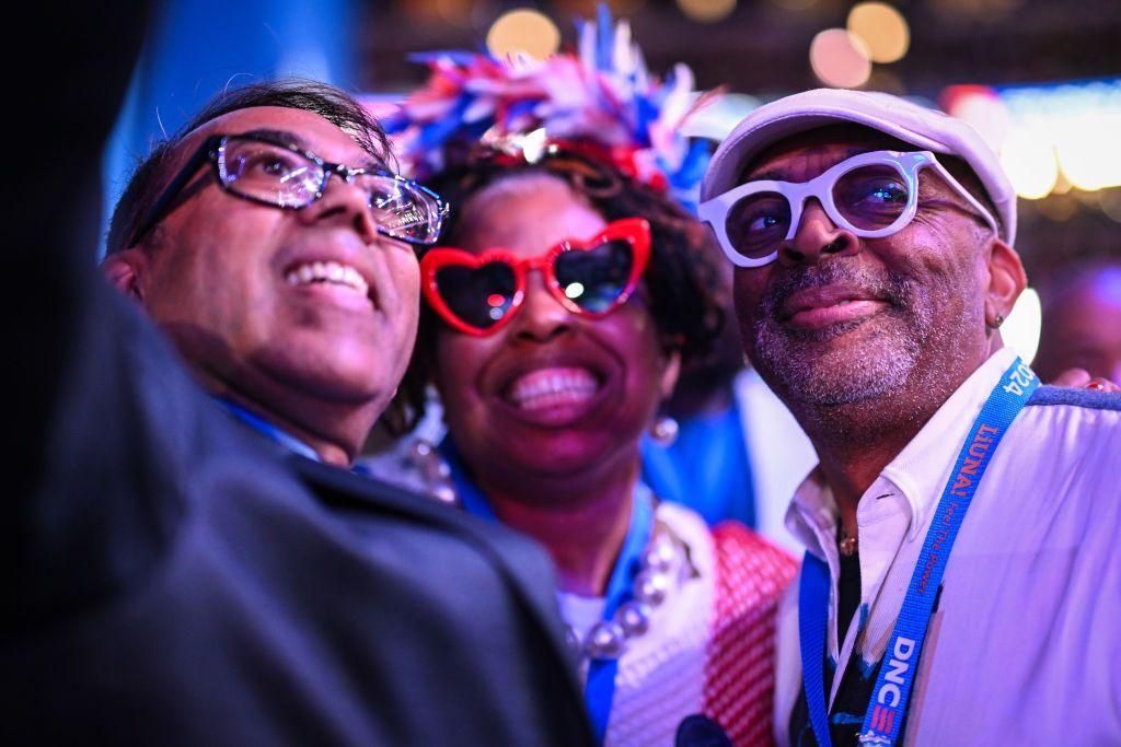 Director and producer Spike Lee (right) poses for a selfie 