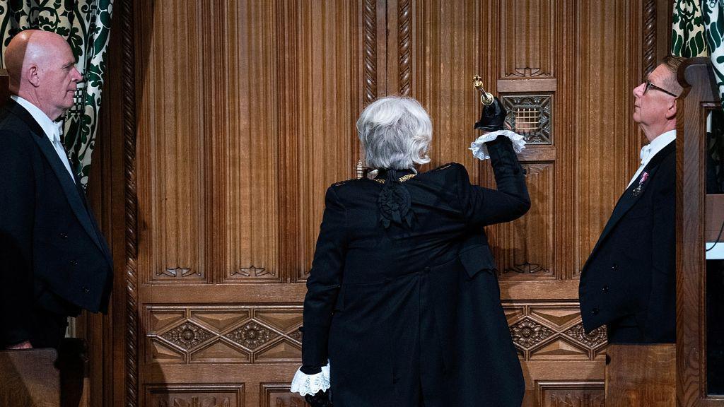 Sarah Clarke, Black Rod, bangs on the door of the House of Commons chamber ahead of the King's Speech during the State Opening of Parliament in 2024.