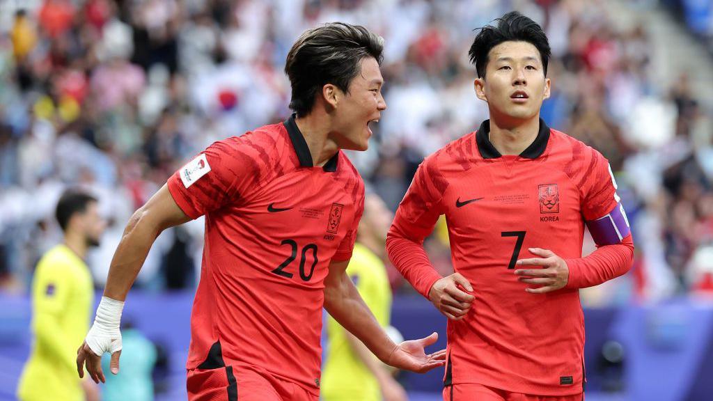 Oh Hyeon-gyu celebrates with Son Heung-min