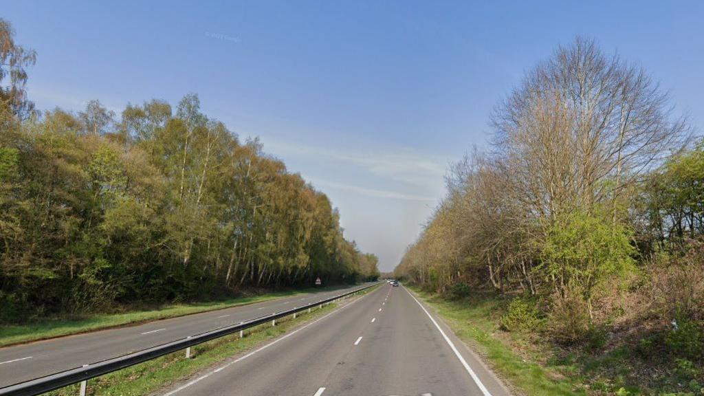 The A322 near Lightwater is a four lane stretch of dual carriageway with trees either side