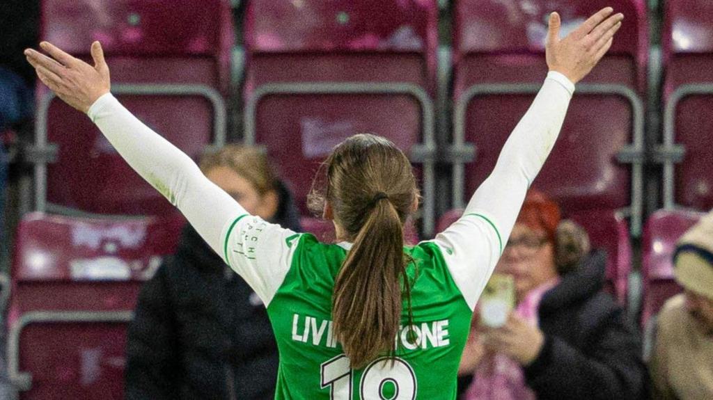 Rosie Livingstone celebrates after scoring for Hibernian against Hearts