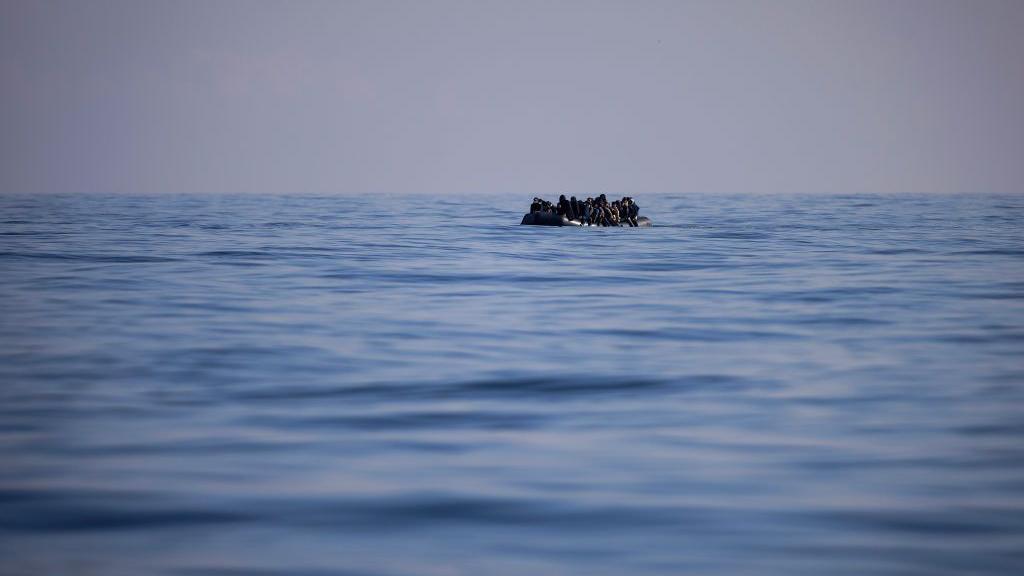 A small boat crossing the channel