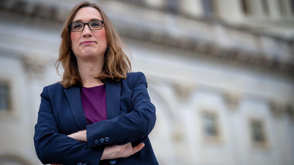 Sarah McBride posing in front of Congress