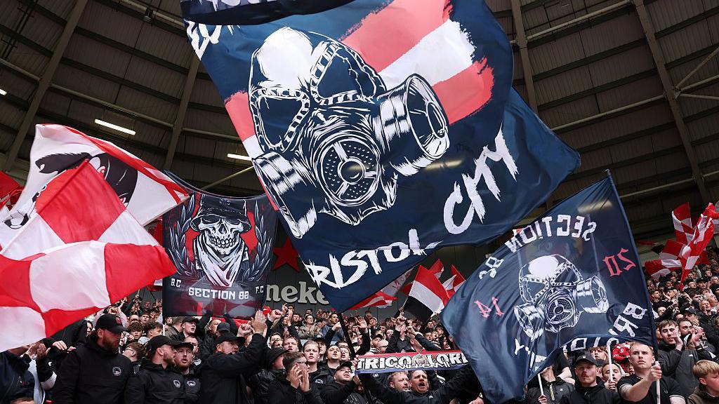 Supporters at Ashton Gate hold up banners