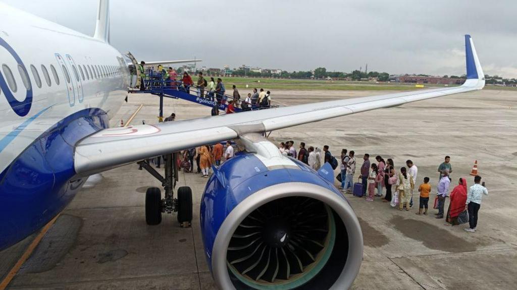 Passengers line up and wait for boarding at IndiGo Airlines flight in Jaipur International Airport in Rajasthan State, India, on September 7, 2024.