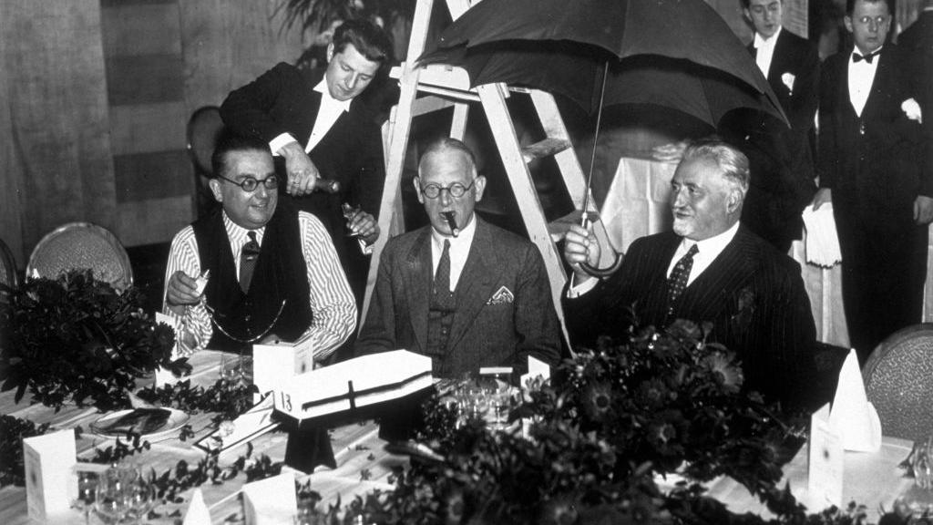 13th November 1936: Members of the Eccentric Club of London, at their annual 'Friday the Thirteenth' lunch, surrounded by omens of bad luck. (Photo by E. Dean/Topical Press Agency/Getty Images)