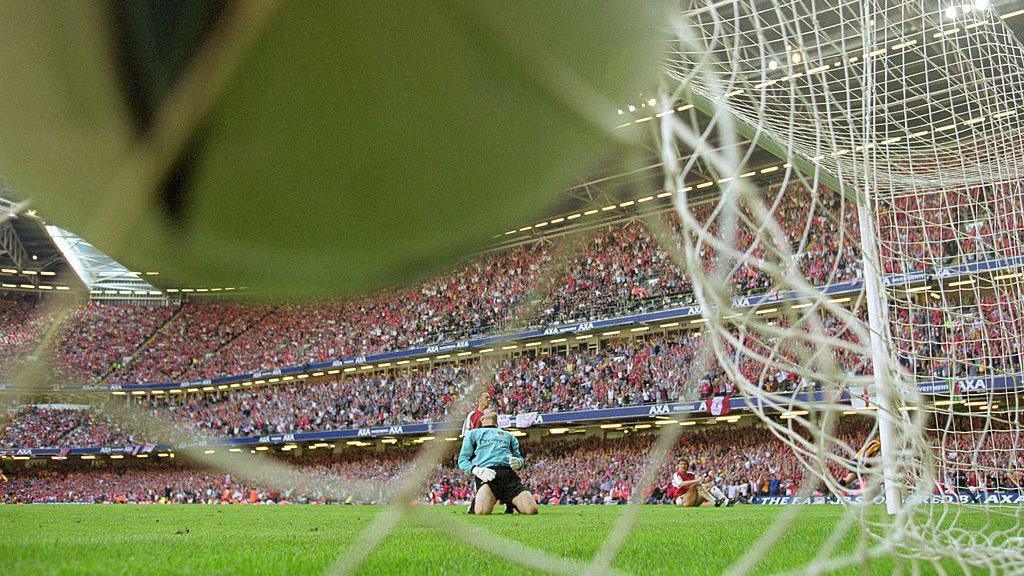 Michael Owen scores