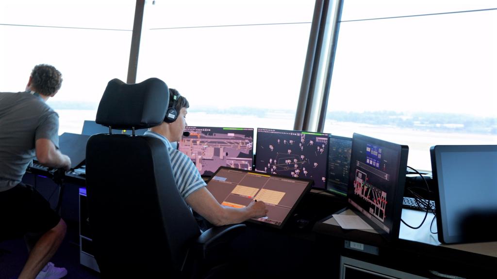 An air traffic control official monitoring screens