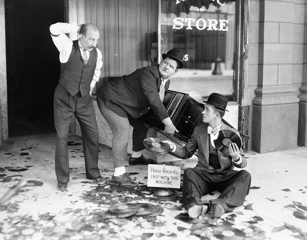 A black and white image of James Finlayson as an awestruck store manager staring at the records broken by the clutsy characters played by Laurel and Hardy in the 1929 comedy Liberty.