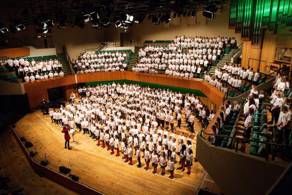 Choir singing on stage at St David's Hall, Cardiff