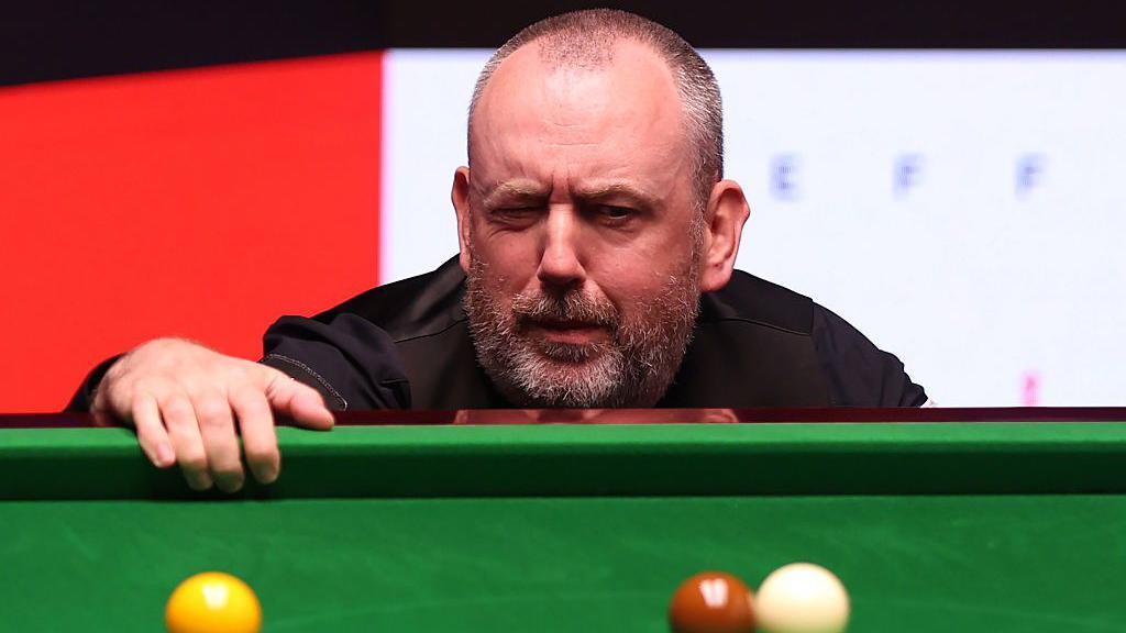 Mark Williams of Wales reacts against Wu Yize of China during the first round match on day two of the Halo World Snooker Championship 2025 at Crucible Theatre on April 20, 2025 in Sheffield, England.