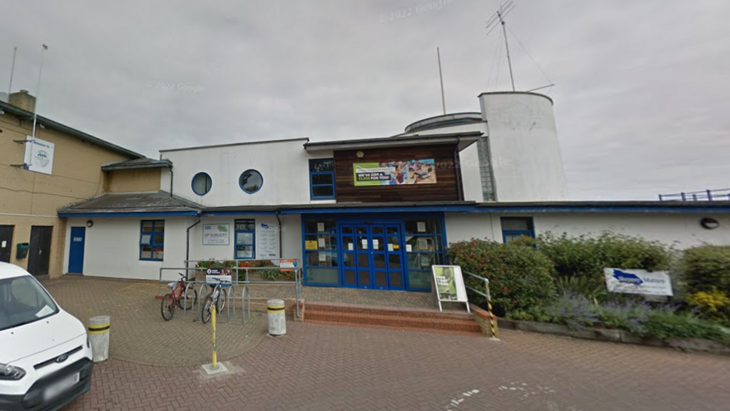 A Google Street image of the white and blue healthy living centre.