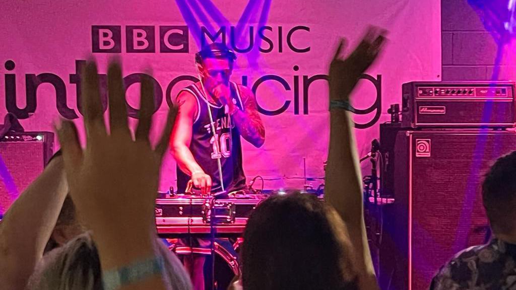 A DJ performs on the BBC Music Introducing stage at Humber Street Sesh