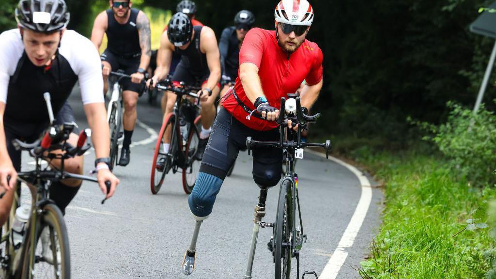 Billy Monger competes in the cycling section of Ironman 70.3 in Weymouth