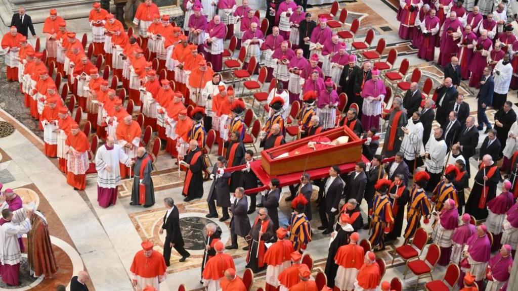 The body of Pope Francis is carried into St. Peters Basilica