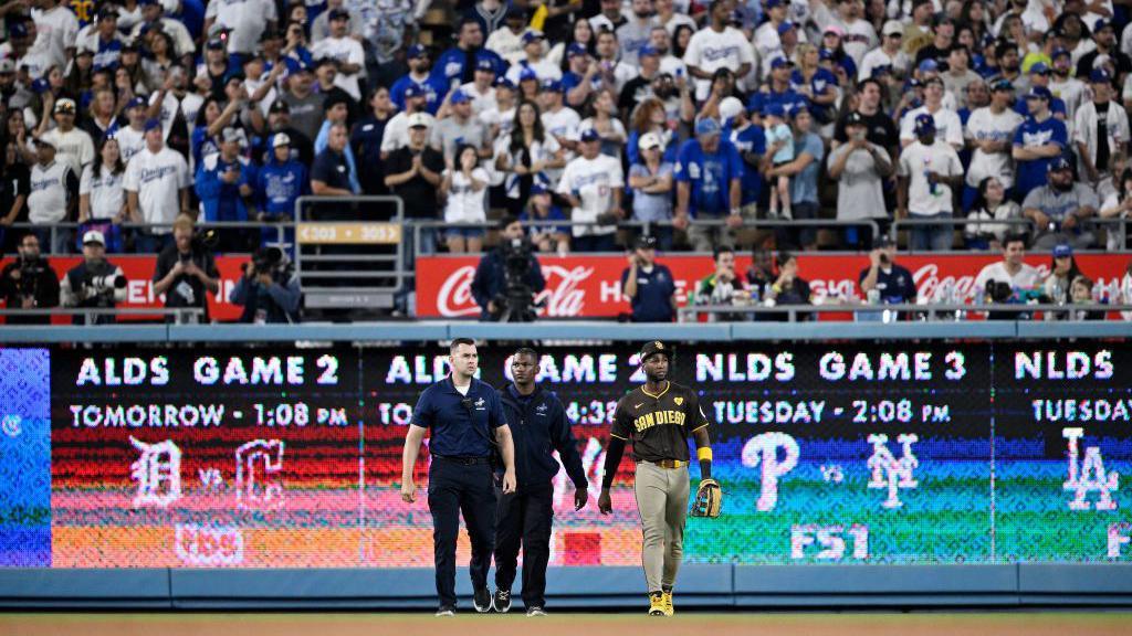 Profar (right) was escorted away from the home fans by security 