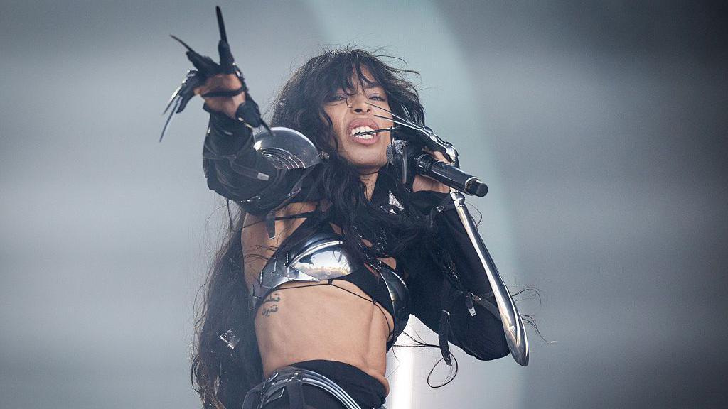 Loreen performs live on stage during Brighton Pride 2025: Pride In The Park at Preston Park on August 02, 2025 in Brighton, England. She is wearing black trousers and a black crop top with long sleeves. She is long black nails on.